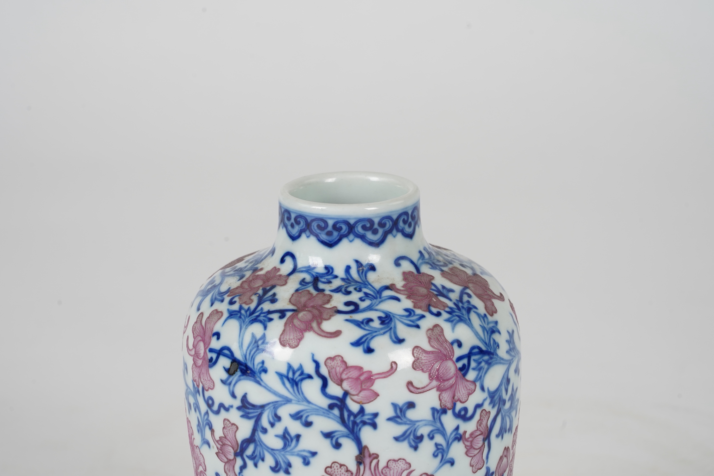 A Chinese pink enamelled and underglaze blue vase, six character Qianlong seal mark to base, possibly Republic period